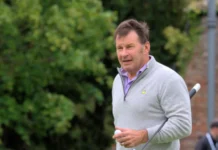 Nick Faldo playing golf.