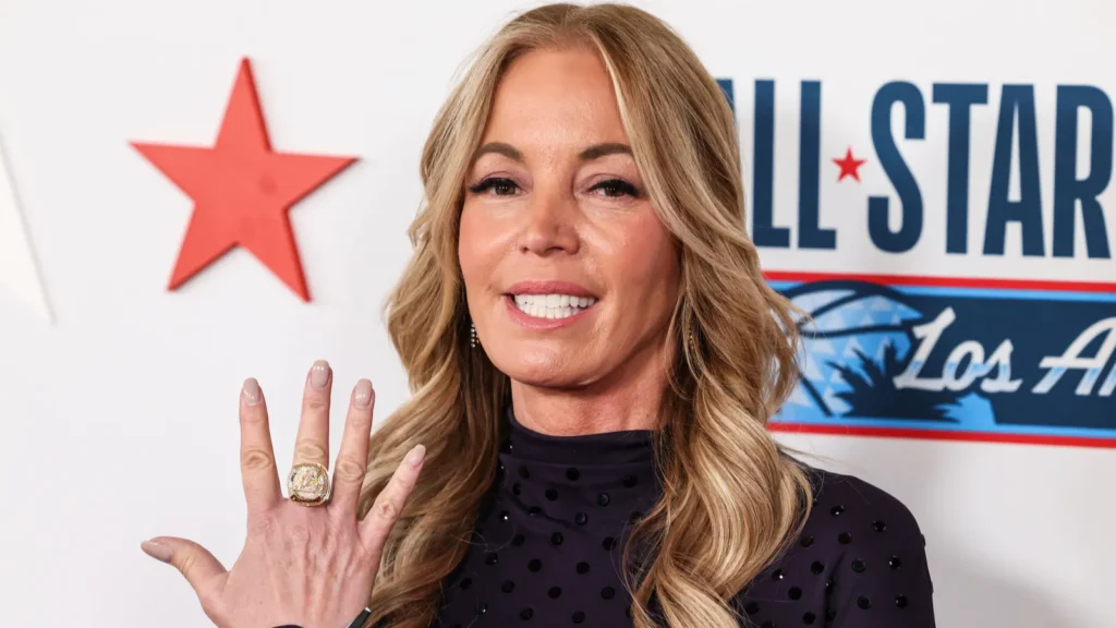 Jeanie Buss showing the back of her hand to the press at an event.