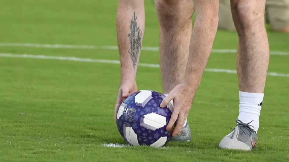 A player putting down an MLS ball