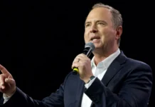 Adam Schiff speaking into the microphone during an event.
