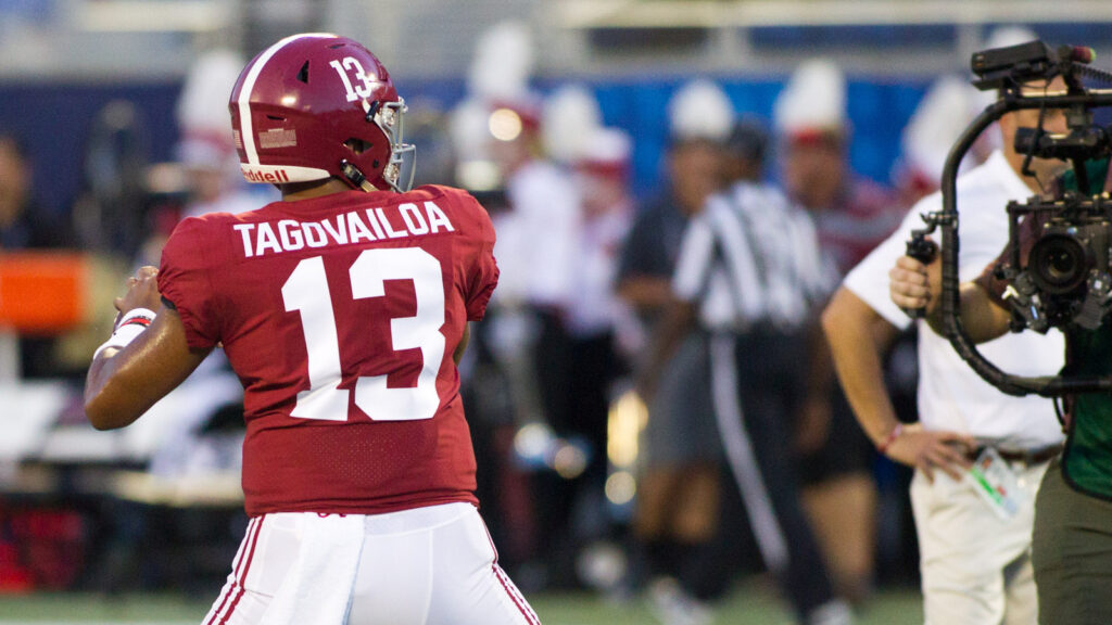 Tua Tagovailoa of alabama watching other players on the field