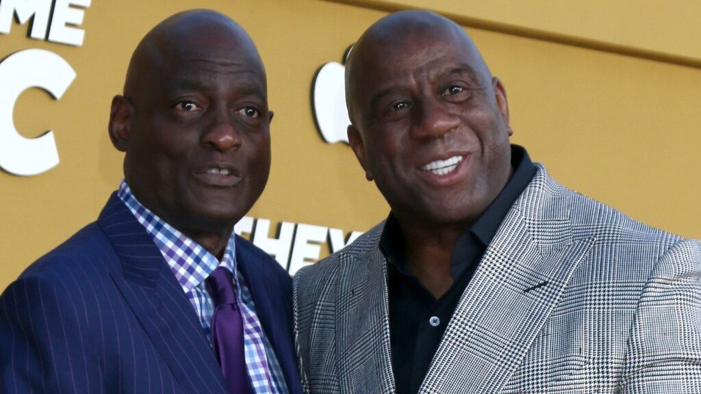 Michael Cooper and Magic Johnson at the musical premiere of They Call Me Magic