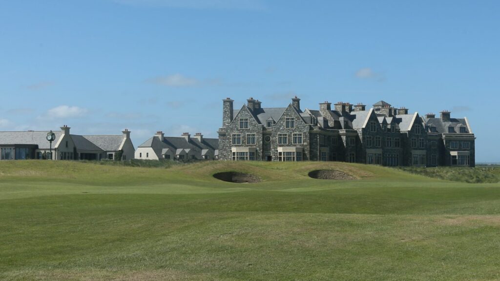 Doonbeg Golf Resort under a clear blue sky.
