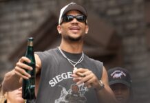 Josh Hart #3 of the NY Knicks rides a float during the New York Knicks Championship Ticket Parade celebrating their 2026 NBA Finals victory