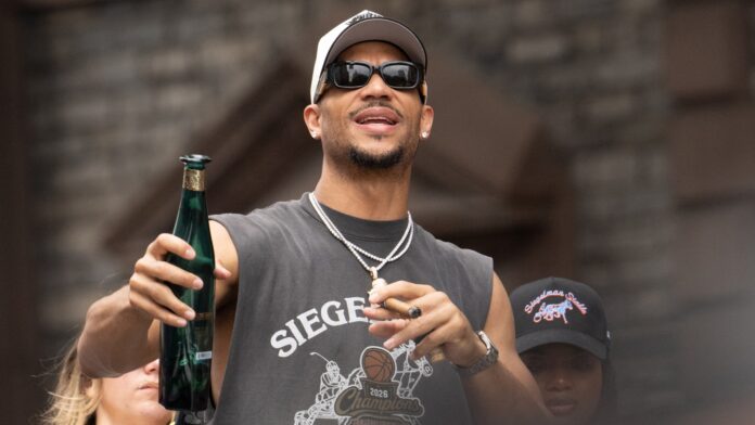 Josh Hart #3 of the NY Knicks rides a float during the New York Knicks Championship Ticket Parade celebrating their 2026 NBA Finals victory