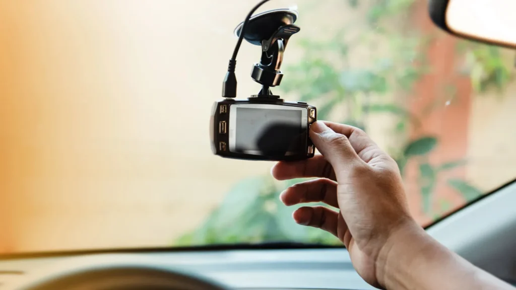 the human hand is touching the cctv car camerafor check