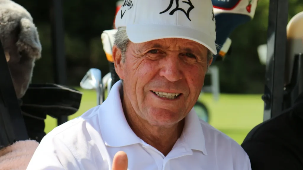 Gary Player smiling into the camera.