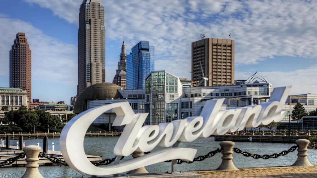 view of cleveland lettering in front of skyline