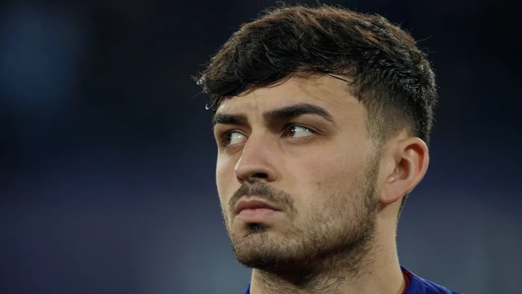 Pedri looking to the side during a football event.