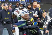 A Seattle Seahawks player carries the ball during a game