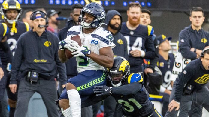 A Seattle Seahawks player carries the ball during a game