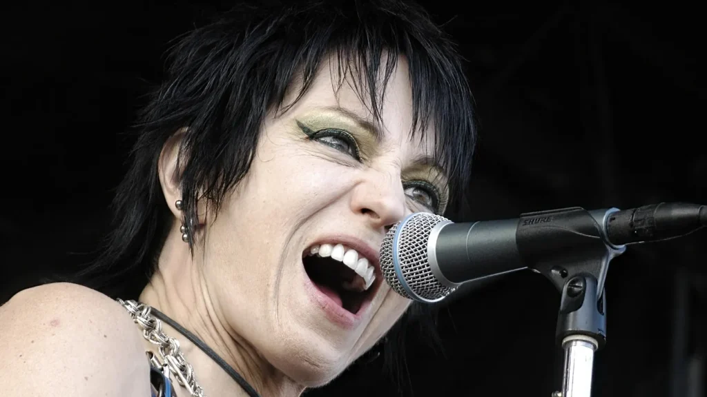 a closeup of joan jett performing at the main stage
