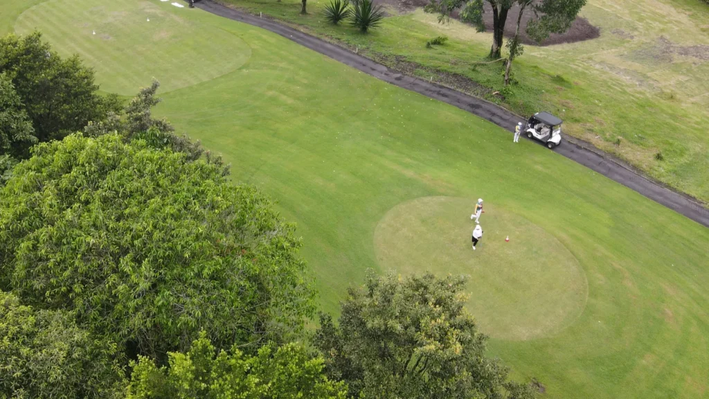 Aerial view of a neatly arranged green golf course