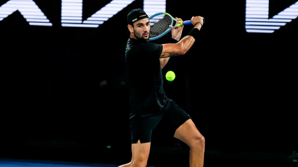 Matteo Berrettini in action during a tennis match.