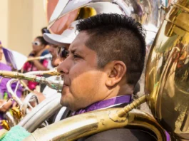 bass tuba player at the procession of san bartolome de