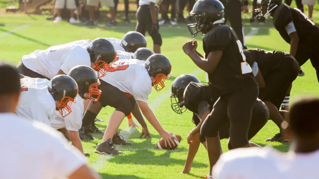 boys playing american football