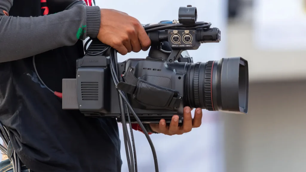 close up professional videographer on event videographer filmmaker cinematographer camera