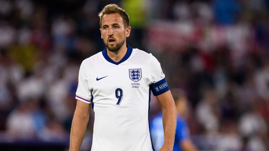 Harry Kane walking in a stadium.