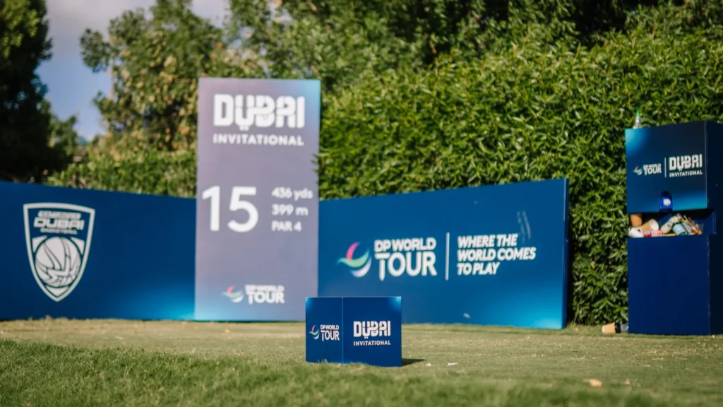 A hole 15 tee marker and branding signage at the DP World Tour golf event in Dubai, United Arab Emirates.