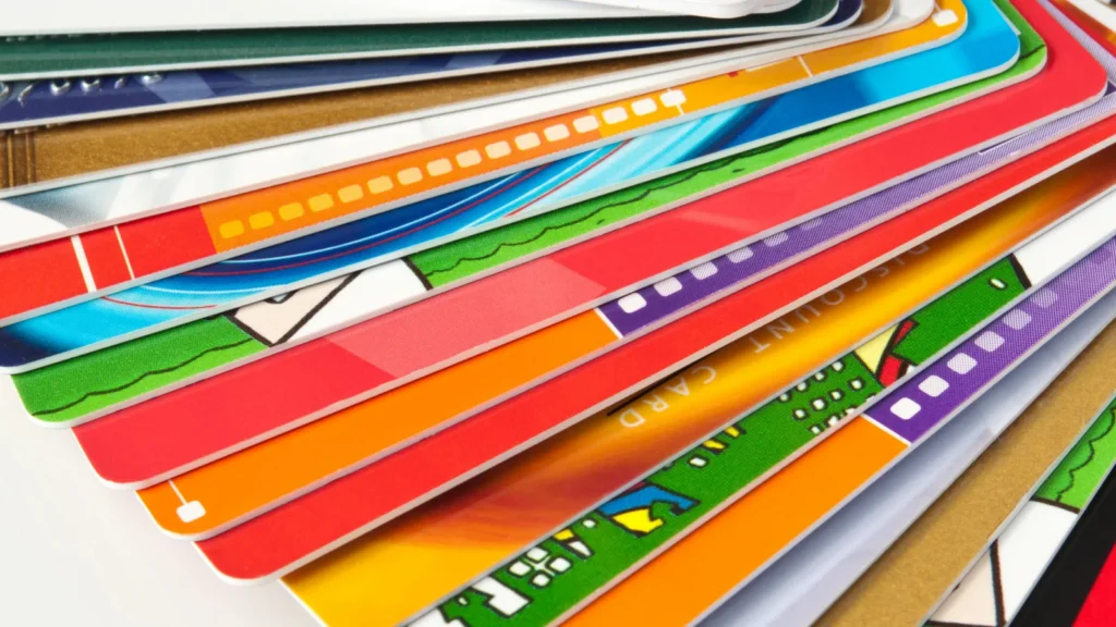 A bundle of cards placed on a white surface.