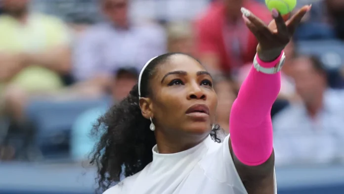 Serena Williams in action during a tennis match.