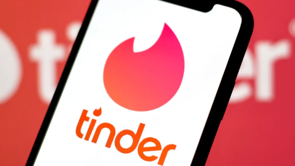 in this photo illustrationthe logo of tinderis displayed on a