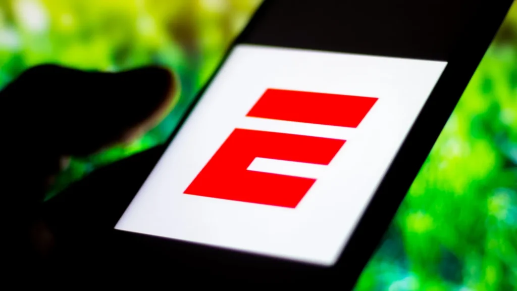 ESPN logo is displayed on a smartphone