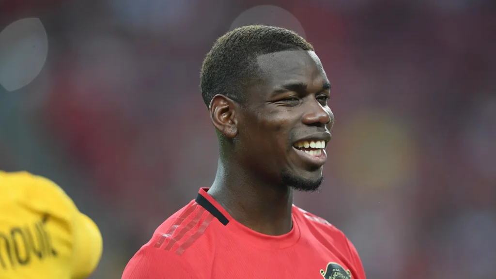 Paul Pogba smiling during the game
