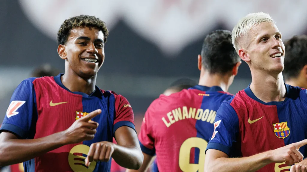 Lamine Yamal and Dani Olmo celebrate after scoring.
