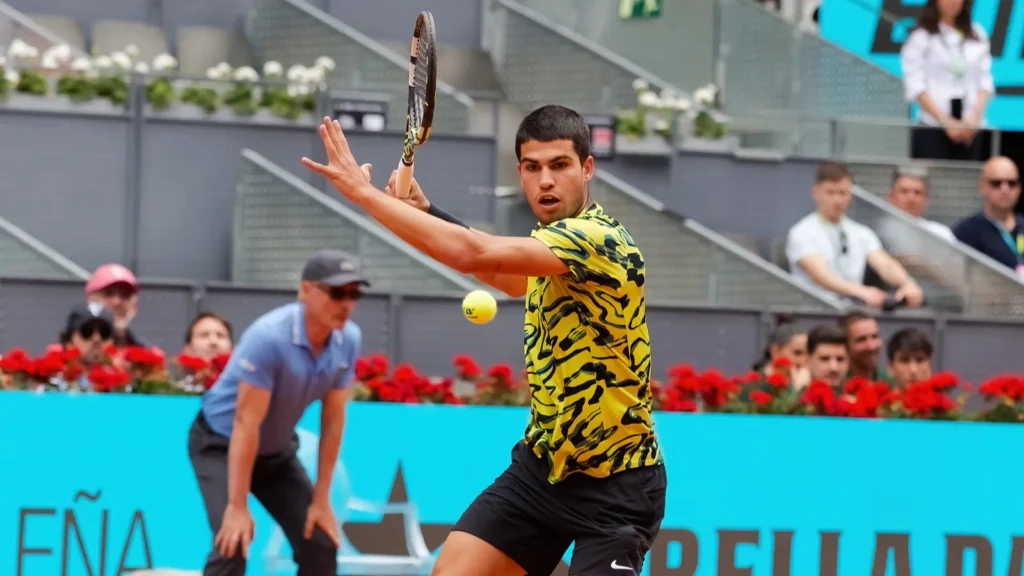 Carlos Alcaraz in action during a tennis match.