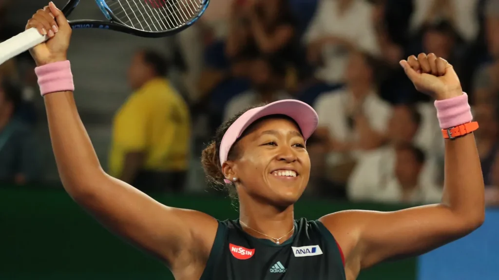 Naomi Osaka celebrating a victory