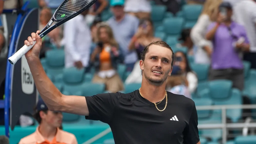 Alexander Zverev celebrating victory during a tennis match.