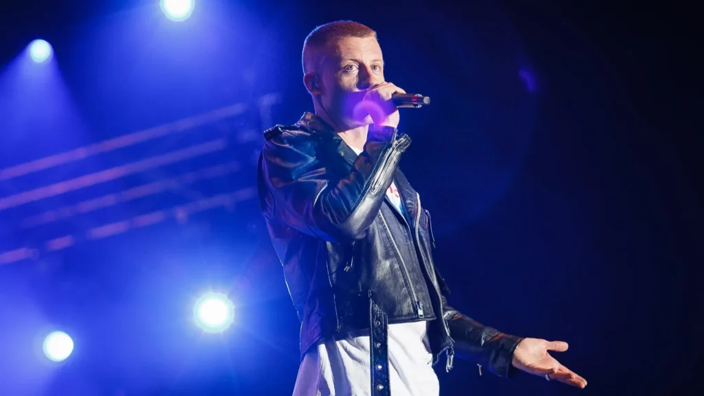 Macklemore performs on stage during a concert in Moscow.