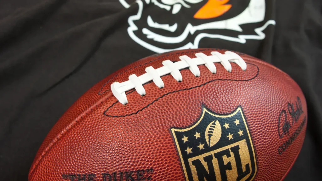 Cincinnati Bengals' logo beneath an official NFL football