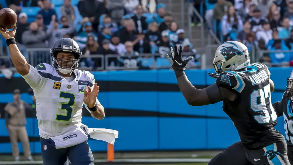 Seattle Seahawks quarterback throws the ball during a game.