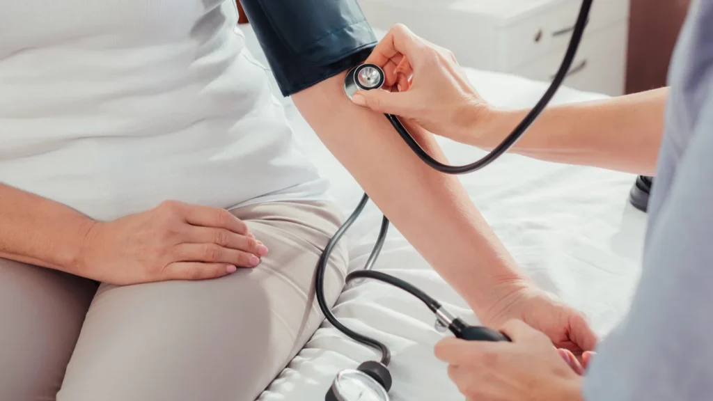 nurse measuring blood pressure to patient
