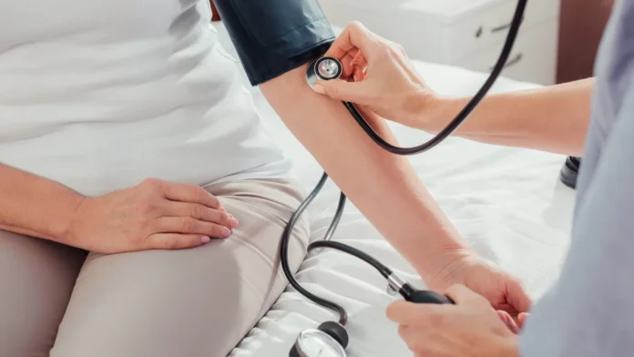 nurse measuring blood pressure to patient