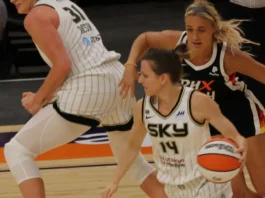 Sophie Cunningham chasing an opposing player on the basketball court