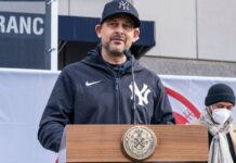 Aaron Boone speaking at an event.