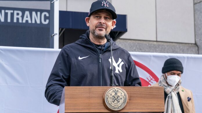 Aaron Boone speaking at an event.