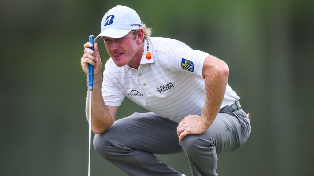 Brandt Snedeker crouching on the field during a game.