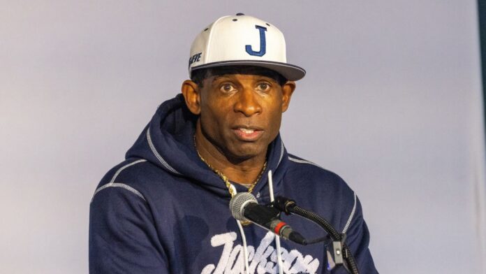 shutterstock deion sanders 2215042739 Deion Sanders addressing at an event.