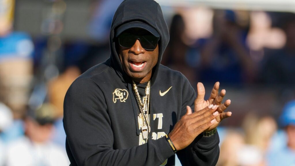 Colorado head coach Deion "Coach Prime" Sanders watches during a warm up before an NCAA college football game between the UCLA and the Colorado in Pasadena, Calif.
