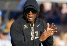 Colorado head coach Deion "Coach Prime" Sanders watches during a warm up before an NCAA college football game between the UCLA and the Colorado in Pasadena, Calif.