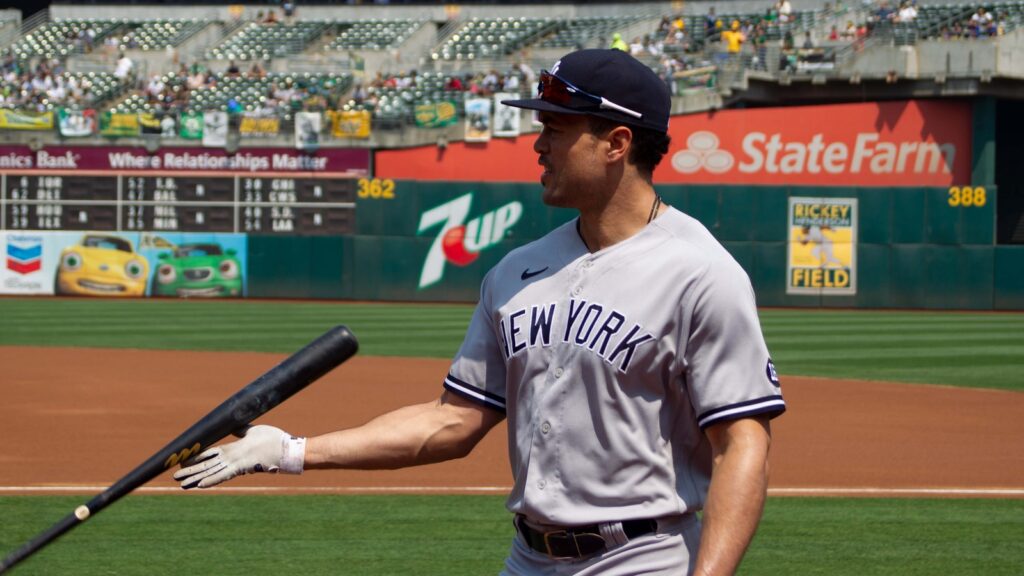 New York Yankees' Giancarlo Stanton #27 walks into the dugout before a game against Oakland Athletics at RingCentral Coliseum