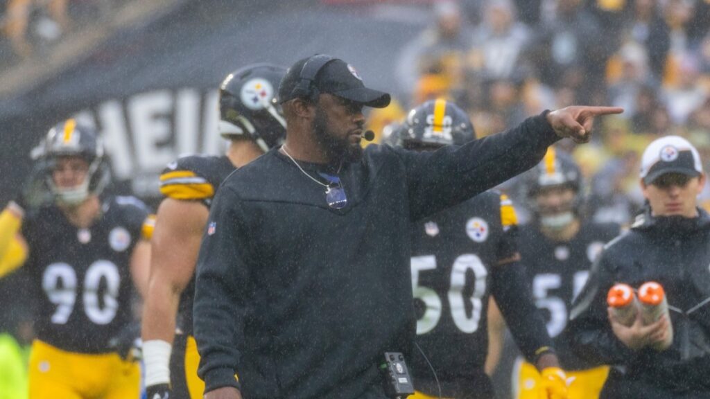 Mike Tomlin, head coach of Pittsburgh Steelers on the field with players