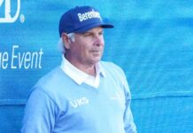 Fred Couples lines up a shot on the 18th green during the first round of the PNC Championship