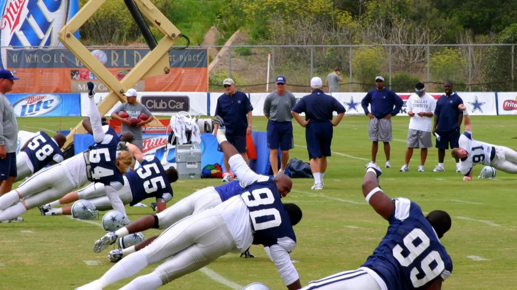 Dallas Cowboys players stretch during a training session