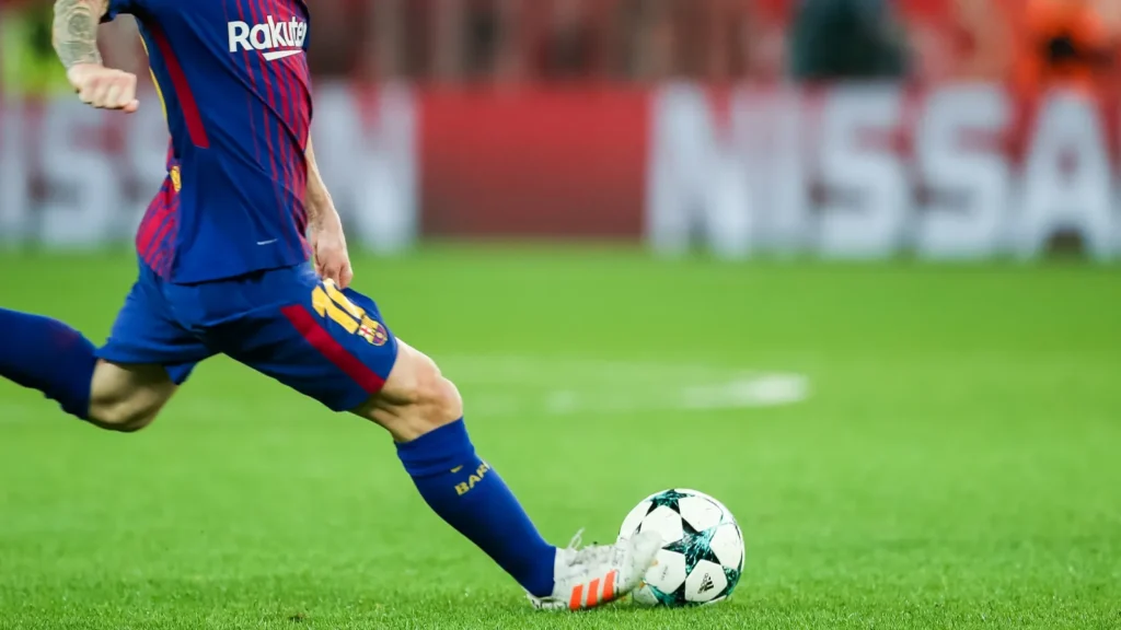 footballer kick the ball
