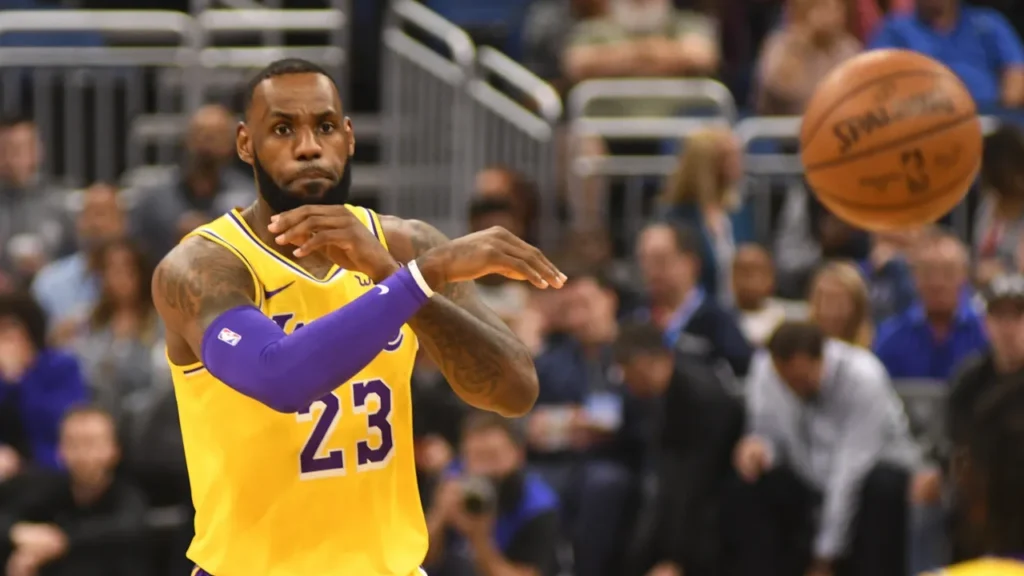 LeBron James passing a basketball during a game.